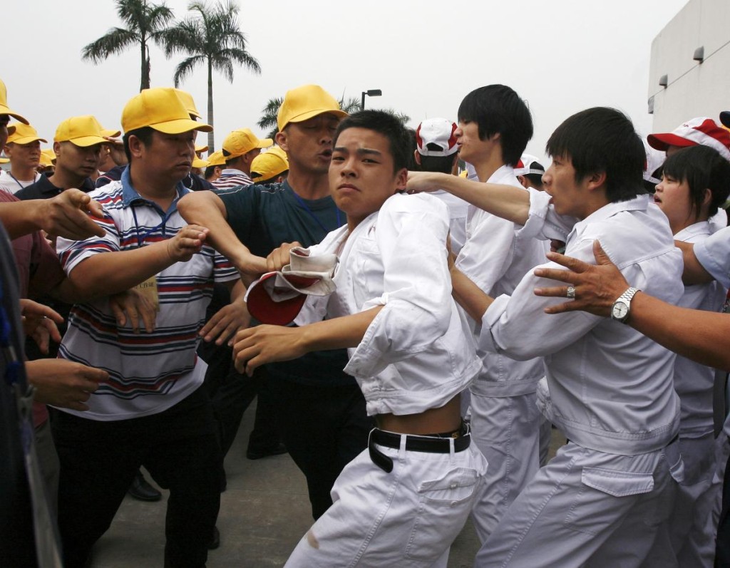 Honda workers take a united stand against the union on 31 May 2010. Photograph: Bobby Yip, Reuters.